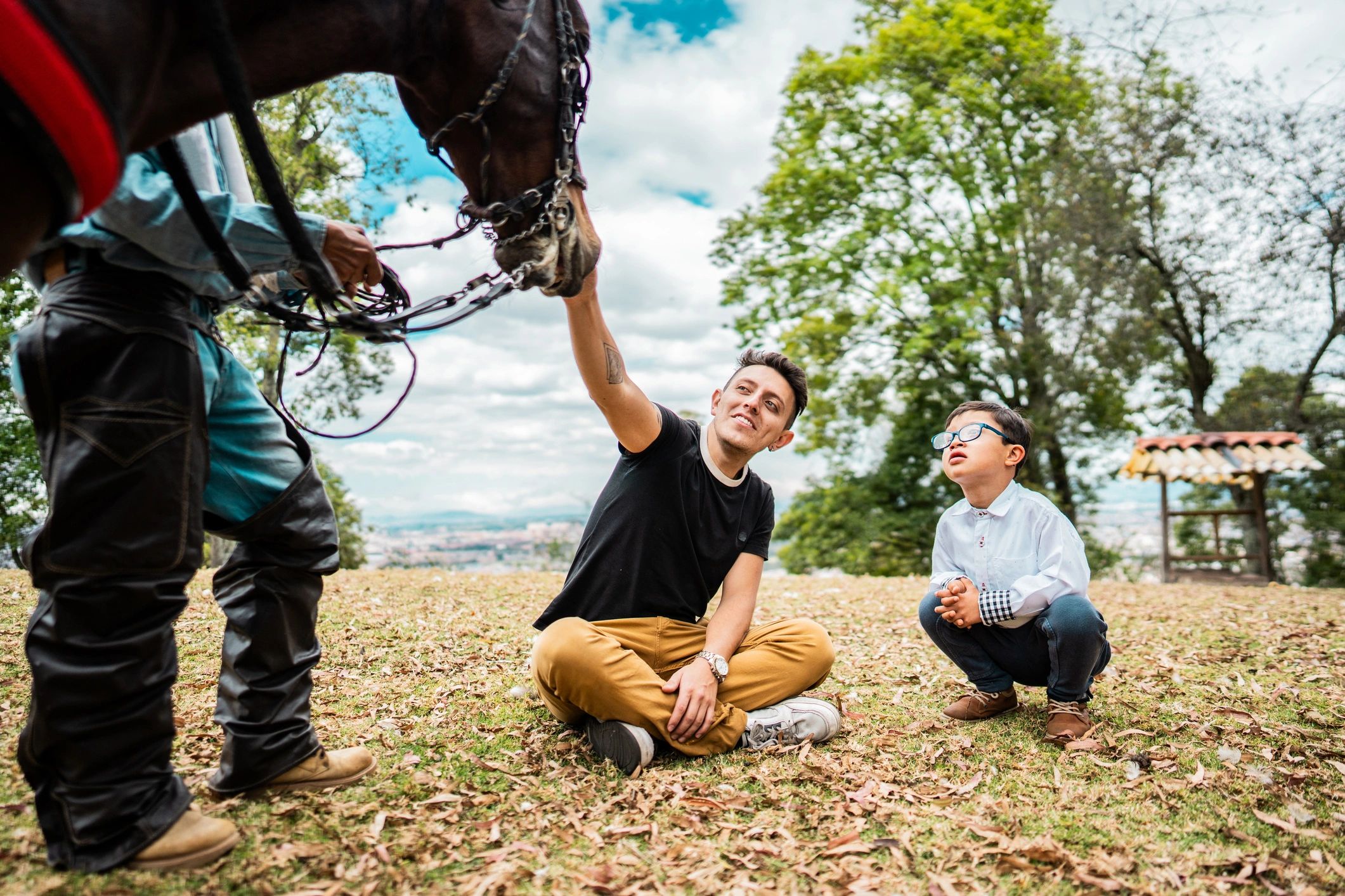 Two people with a horse during an equine therapy session